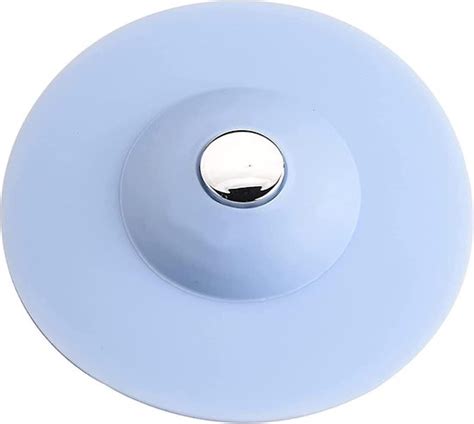 Foto van een siliconen afvoerstop met een zichtbaar filter, in grijs, die haren en etensresten opvangt.