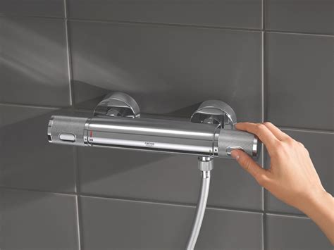 Illustratie van een Grohe thermostaatkraan met de temperatuurindicatie op de kraan zelf.