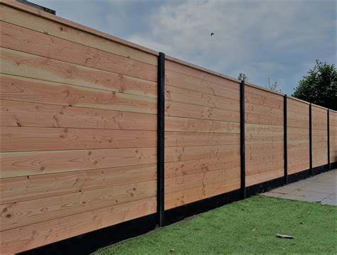 Schematische weergave van de maximale hoogtes van schuttingen in een tuin