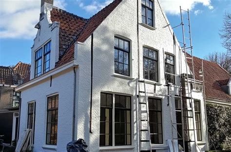 Diagram van binnen- en buitenschilderwerk met onderhoudsintervallen