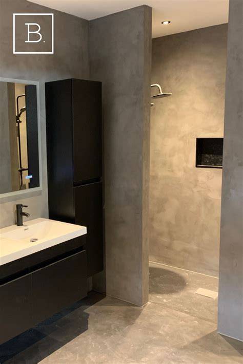 Doorlopende beton ciré wand- en vloeren in een badkamer