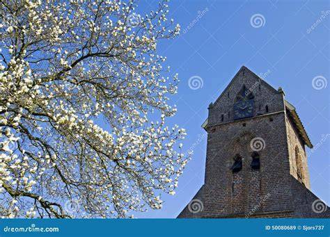 Afbeelding van Breedenbroekse kerktoren en dorpslandschap