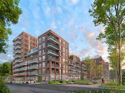 Foto van een gerenoveerd wooncomplex met nieuwe gevelafwerking en ramen.