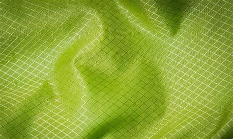 Schema: Vergelijking van doekmaterialen (nylon, polyester, silnylon) en coatings (PU, silicone)