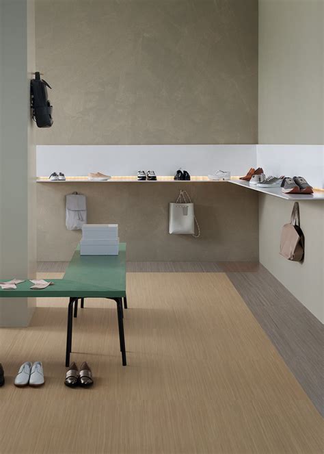 Collage van verschillende Marmoleum Click designs, waaronder houtlooks, steenlooks en felle kleuren