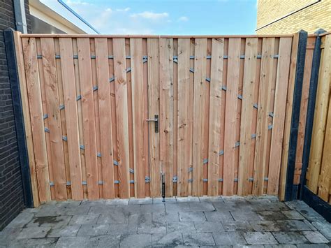 Illustratie van een dubbele schuttingpoort met afmetingen