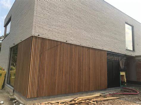 Grafiek: vergelijking houten versus stenen gevelbekleding