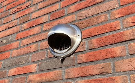 Afbeelding van een buitenmuur met afzuigkap doorvoer