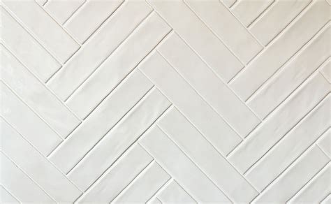 Visualisatie van een witte tegel met een donkere voeg, die de vorm van de tegel accentueert.