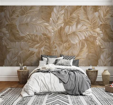 Voorbeelden van groene, gouden en beige bladeren behang