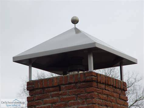 Afbeelding: schematic van een schoorsteenkap met regenkap, trek en ventilatie