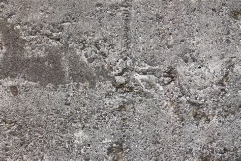 Close-up van verweerde beton- en metaaltextuur