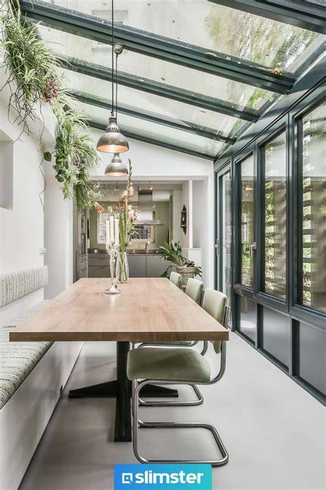 Interieurinspiratie: living en eetkamer verbonden met glazen serre
