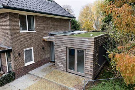 Voorbeelden van multifunctionele garage-uitbouwen
