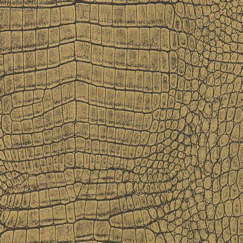 Beeld van goudkleurig metallic behang met alligator dessin en structuur