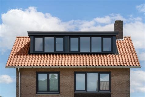Voorbeeld van een houten dakkapel op een woning