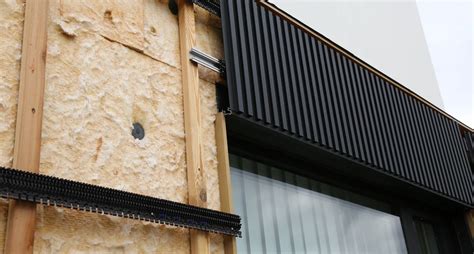 Schematische weergave van een goed geïsoleerde gevel met de Rc-waarde als centraal element.