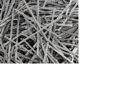 Detailfoto van kunststofvezels in betonmengsel